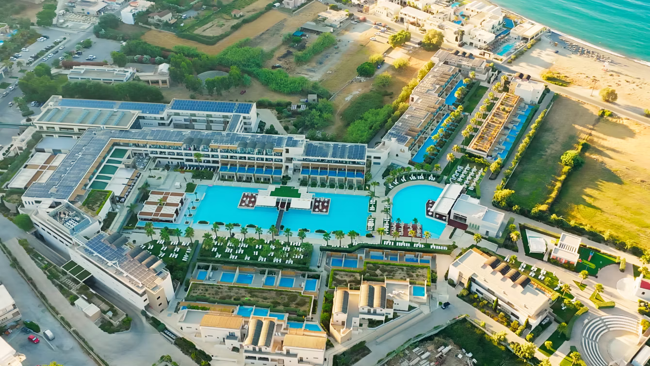 Beachfront resort and its pool complex from directly above